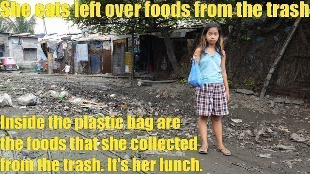 'A Poor Filipino Child Looking for Food in the TRASH. Filipino Family Living in Extreme Poverty'