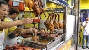 'Hong Kong Street Food. The Roasted Bird Dipped in Sauce'