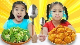 'Annie and Suri Pretend Play the Big and Small Spoon Food Challenge with Mystery Wheel'