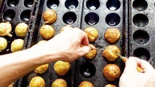 'Takoyaki (Octopus balls) - Japanese street food'