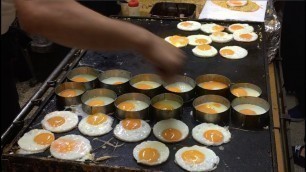 'Eggs with Octopus-Flavored Rice Cracker in Festival Japanese Street Food'
