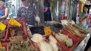 'Hong Kong Street Food. Grilling Dried Squid and Seafood'