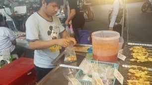 'Bangkok street food - grilled octopus and cuttlefish'