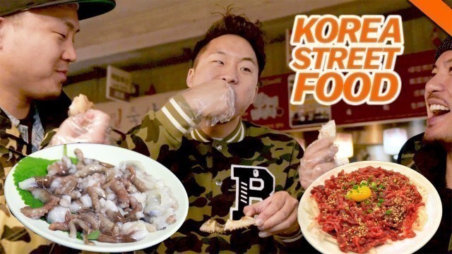 'EATING LIVE OCTOPUS & OTHER WEIRD KOREAN STREET FOOD AT GWANGJANG MARKET -SEOUL'