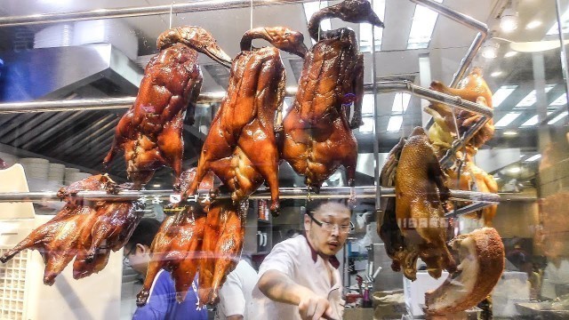 'The Chinese Roasted Duck Tasted in Mong Kok, Hong Kong. Chinese Street Food.'