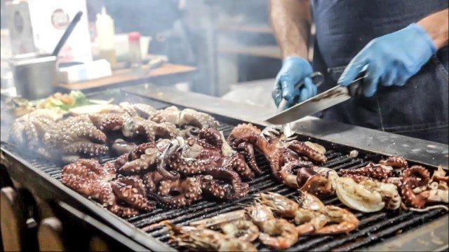'Huge Grill of Octopus, Seafood, Fish and More. Sardinia Street Food Fair, Olbia, Italy'