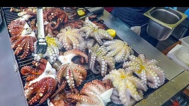 'Italy Street Food. Grilled Octopus, Squid, Shrimps and Yummy Sandwich \'Puccia\''