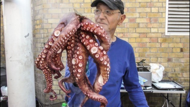 'Giant Octopus, Filled Squid, Whitebait from Galicia, Spain. Street Food of London Brick Lane'