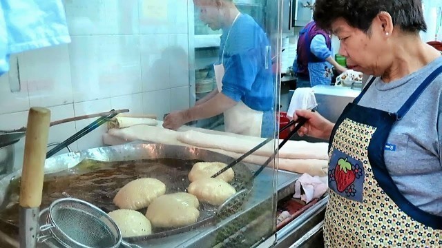'Hong Kong Street Food. The Complicate Art of Making Fried Loaves of Bread'
