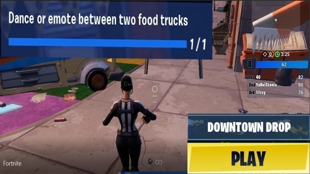 'dance or emote between two food trucks (LOCATION) at the end of video'
